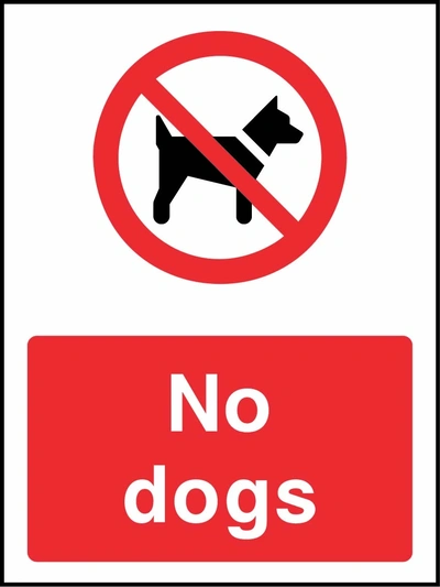 No dogs sign showing red prohibition pictogram above wording. Artwork COUN0071.