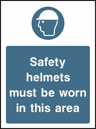 Safety helmets must be worn in this area sign showing blue safety helmet pictogram above wording. Artwork PPE0037.