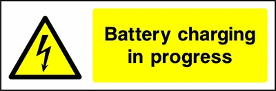 Battery charging in progress sign showing yellow electrical lightning bolt warning triangle beside wording. Artwork ELEC0031.