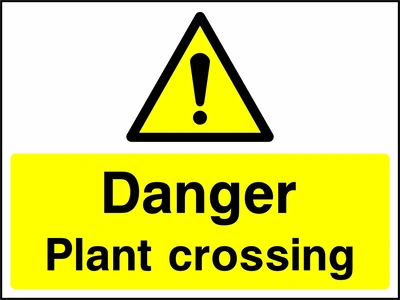 A black exclamation mark inside a yellow warning triangle above black wording on a yellow panel with Danger — Plant crossing wording. CONS0095 artwork.
