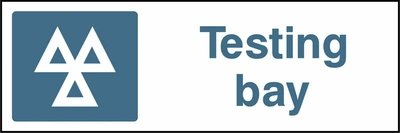 Testing bay sign showing a blue identification pictogram beside the printed location wording. Artwork GARA0015.
