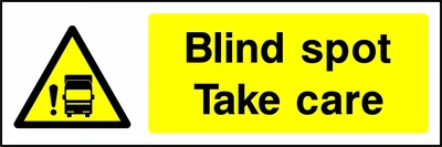 Blind spot — Take care sign showing yellow truck and exclamation warning pictogram beside wording. Artwork GENE0047.