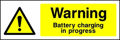 Warning — Battery charging in progress sign showing yellow exclamation warning pictogram beside wording. Artwork GENE0013.