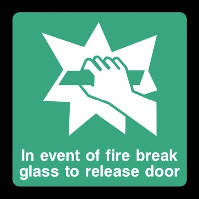 Green and white In event of fire break glass to release door sign showing hand breaking glass pictogram. Artwork EMER0064.