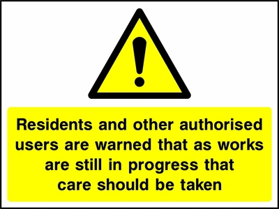 Yellow and black warning notice asking residents and authorised users to take care while works are still in progress. CONS0098.