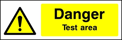 Danger — Test area sign showing yellow exclamation warning pictogram beside wording. Artwork GENE0023.