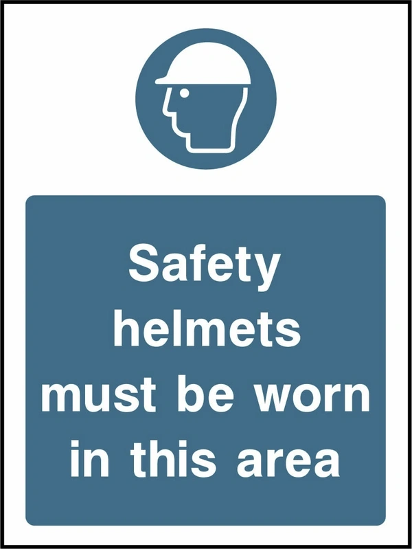 Safety helmets must be worn in this area sign showing blue safety helmet pictogram above wording. Artwork PPE0037.