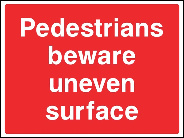 Large white lettering on a red background with Pedestrians beware uneven surface wording. CONS0087 artwork.