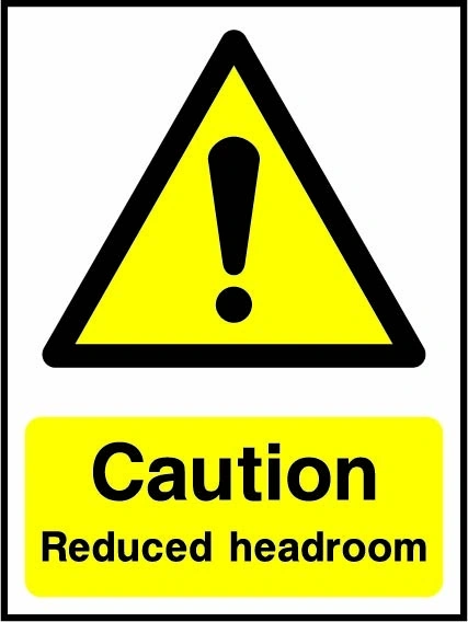 Caution — Reduced headroom sign showing yellow exclamation warning triangle above wording. Artwork LIFT0005.