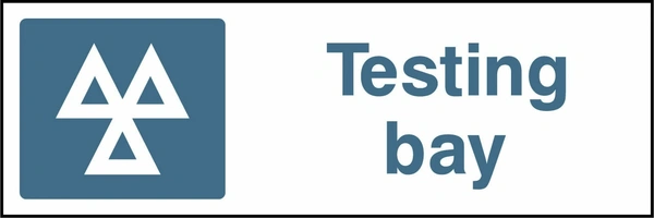 Testing bay sign showing a blue identification pictogram beside the printed location wording. Artwork GARA0015.